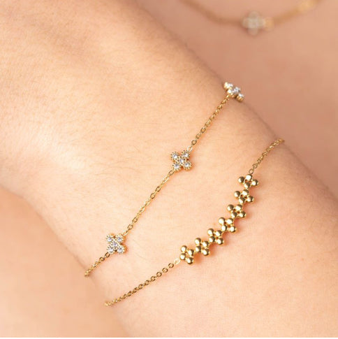 Armband klavertjes met steentjes goud