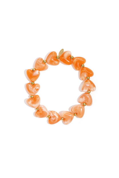 Armband met oranje hartjes kralen
