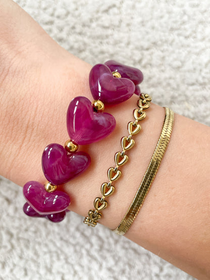 Armband met paarse kralen en gouden details