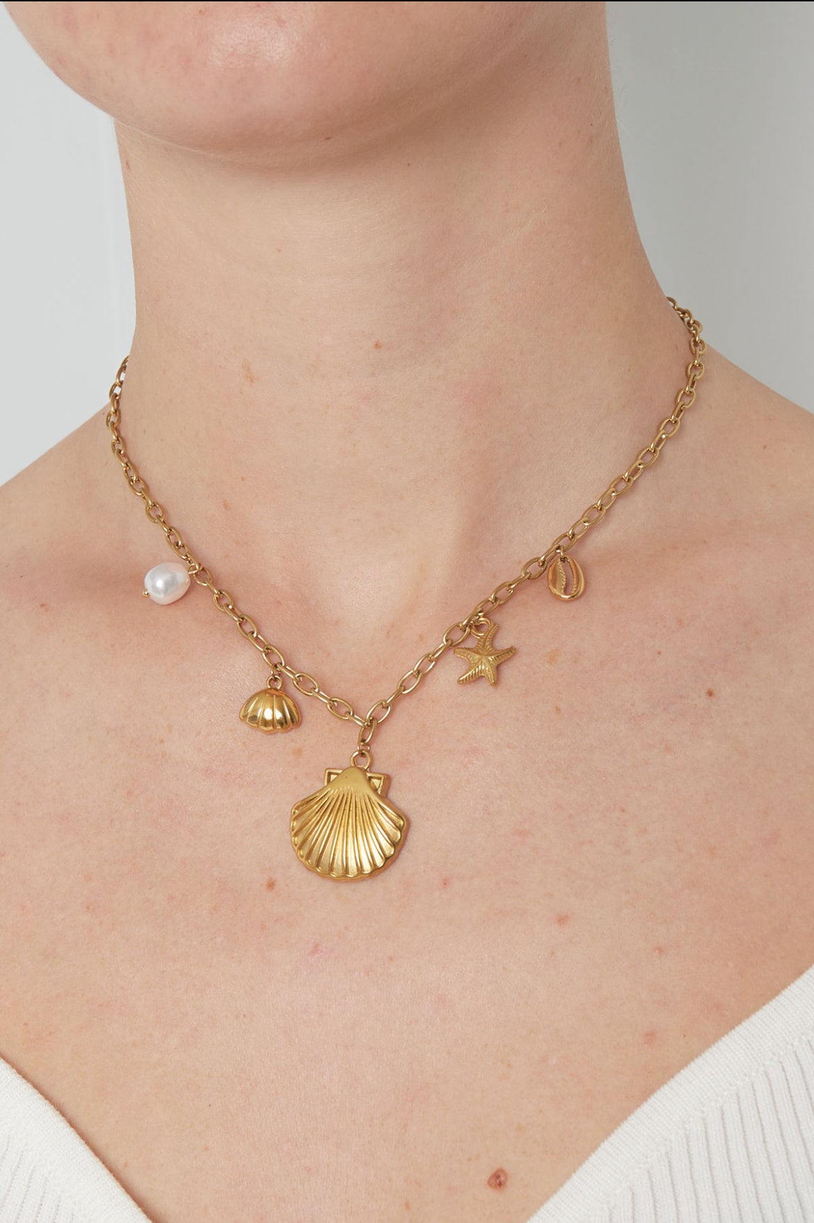 Bedel ketting met schelpen goud