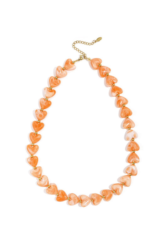 Ketting met oranje hartjes kralen