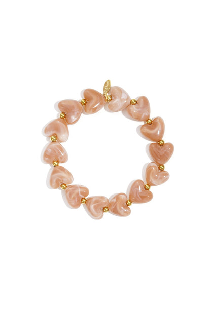 Kralen armband met zalm kleurige hartjes kralen